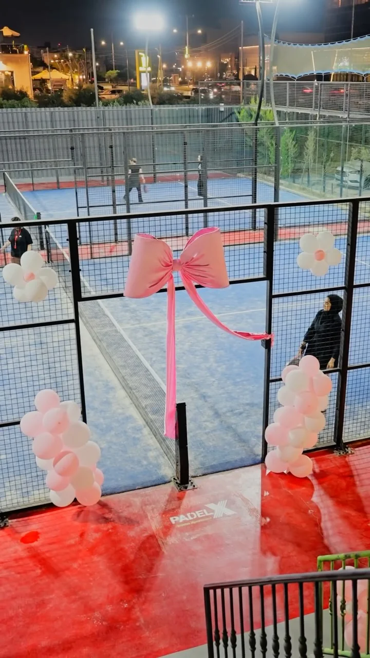 Padel X courts dressed with pink bows and balloons for a Padel Girls Club night